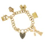 A 1970s 9ct gold charm bracelet. The curb-link chain suspending five charms, to include a 9ct gold