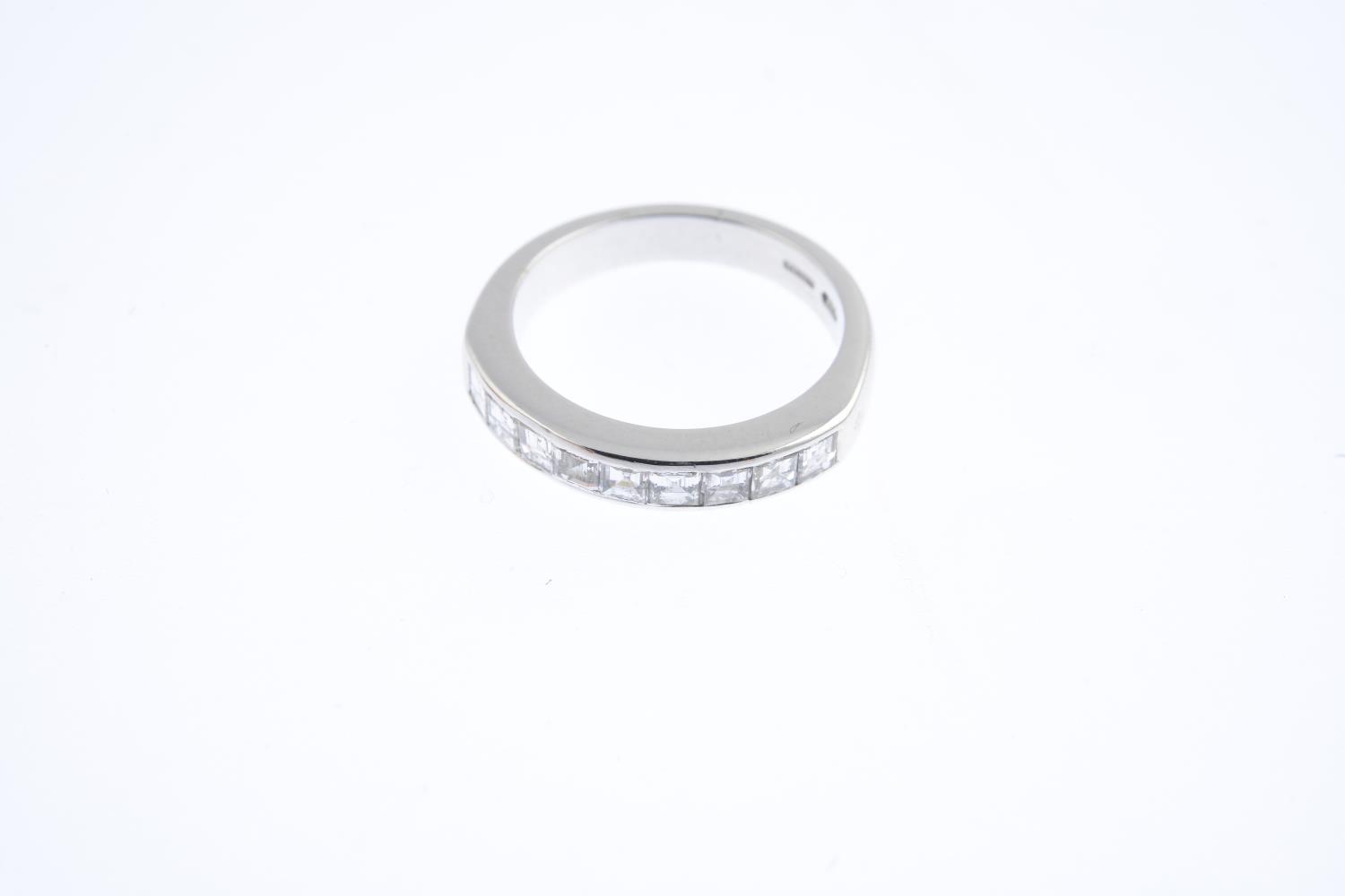 An 18ct gold diamond half eternity ring. Designed as a square-shape diamond line, within a channel - Image 3 of 3