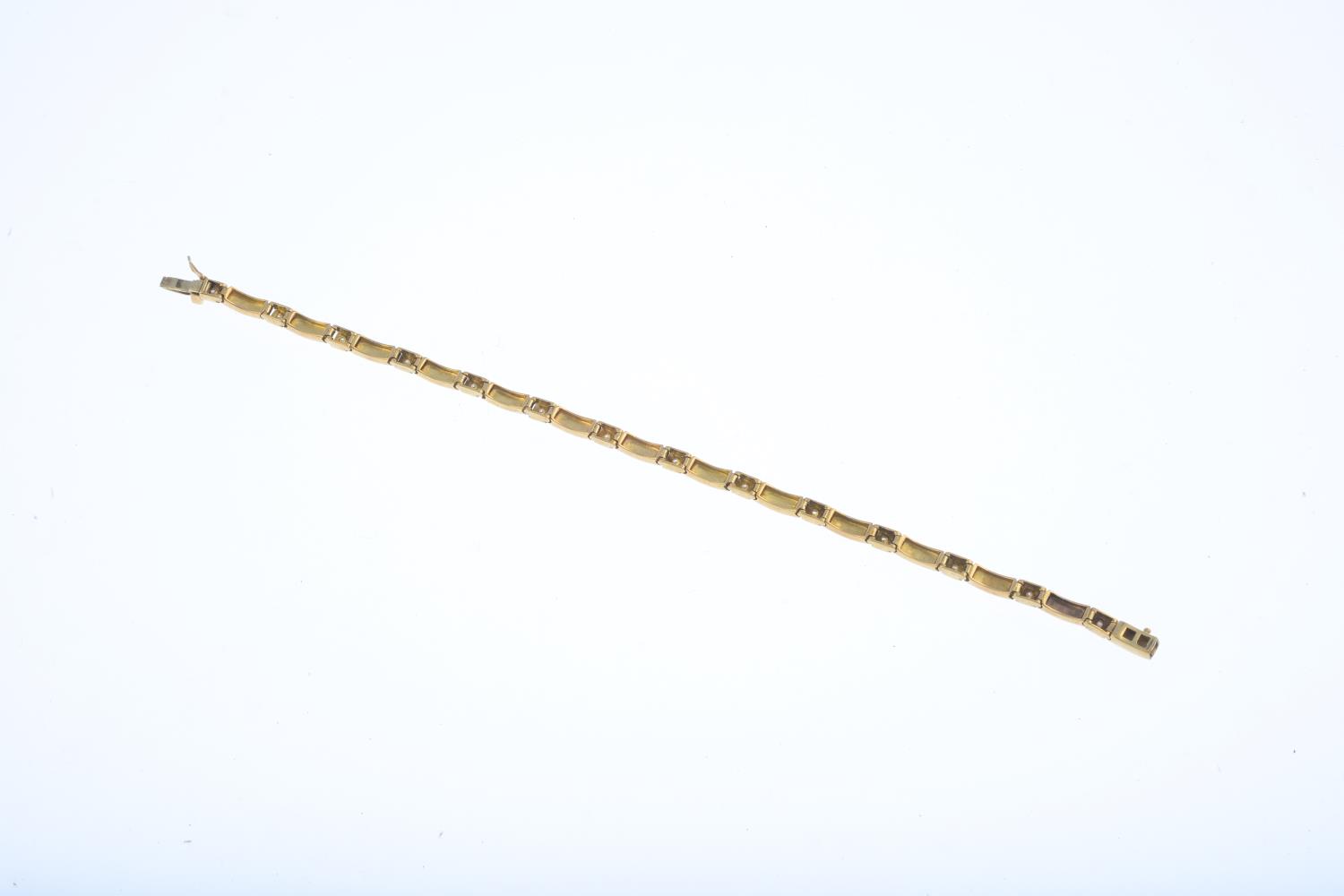 A 9ct gold diamond bracelet. The brilliant-cut diamond collet line, with polished rectangular-link - Image 2 of 2