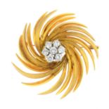 A mid 20th century diamond brooch. Designed as a brilliant-cut diamond cluster, with textured and