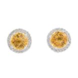 A pair of 18ct gold citrine and diamond cluster earrings. Each designed as a circular-shape citrine,