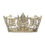 An 18ct gold diamond crown brooch. Designed as a pave-set diamond openwork crown. Retailer's marks