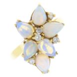 An opal and diamond dress ring. Of abstract design, the pear-shape opal cabochon cluster, with