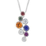 A diamond, sapphire and ruby pendant. Designed as a scattered cluster of brilliant-cut diamond and