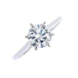 (210852) A diamond single-stone ring. The brilliant-cut diamond, with tapered shoulders. Estimated