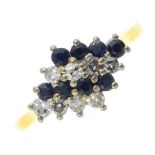 An 18ct gold sapphire and diamond dress ring. The alternating circular-shape sapphire and single-cut