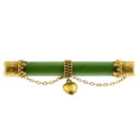 A late Victorian 15ct gold nephrite jade brooch. Designed as a nephrite bar, with textured scrolling