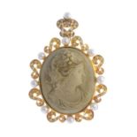 A lava cameo pendant. The lava cameo, carved to depict Bacchante in profile, with brilliant-cut