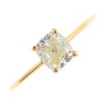 An 18ct gold diamond single-stone ring. The cushion-shape diamond, to the plain band. Estimated