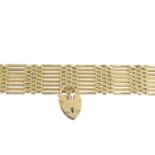 A 1970s 9ct gold bracelet. Designed as an alternating series of gate and brick-links, with heart-