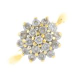 An 18ct gold diamond cluster ring. The brilliant-cut diamond cluster, within a similarly-cut diamond