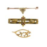 Three early 20th century gold brooches. To include a 9ct gold diamond and garnet-topped-doublet