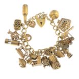 A 1970s 9ct gold charm bracelet. The curb-link chain, suspending twenty charms, to include a 9ct