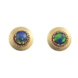 A pair of opal triplet earrings. Each designed a circular opal triplet cabochon, with rope-twist