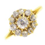 An early 20th century 18ct gold diamond cluster ring. The old-cut diamond, with similarly-cut