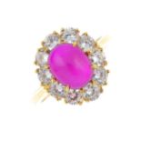 A 9ct gold synthetic ruby and cubic zirconia cluster ring. The oval synthetic ruby cabochon,