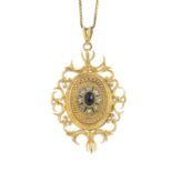 A 9ct gold garnet and split pearl locket pendant. The oval garnet cabochon and split pearl