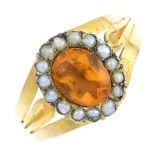 A paste and split pearl cluster ring. The oval-shape orange paste, with split pearl surround and