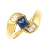 A sapphire and diamond dress ring. The square-shape sapphire, with baguette-cut diamond line