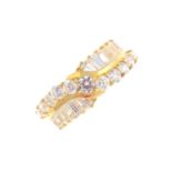 A 14ct gold cubic zirconia dress ring. The circular-shape cubic zirconia undulating line, with