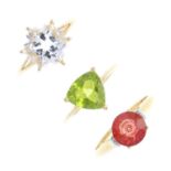 Three 9ct gold gem-set rings. To include a rock crystal and diamond ring, a peridot single-stone