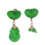 A pair of nephrite jade earrings. Each designed as a carved nephrite jade panel depicting the