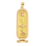 A cartouche pendant. Depicting a series of Egyptian hieroglyphs appearing to spell 'Hesa', with