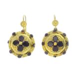 A pair of garnet earrings. Each designed as an oval-shape garnet quatrefoil, with circular-shape