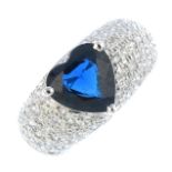 (205944) A sapphire and diamond dress ring. The heart-shape sapphire, atop a pave-set diamond