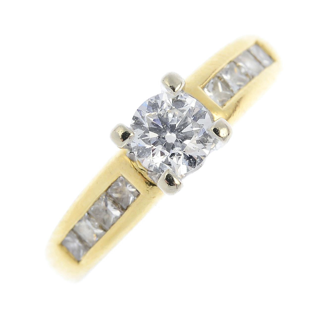 A diamond single-stone ring. The brilliant-cut diamond, with square-shape diamond line sides.