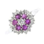 An 18ct gold ruby and diamond cluster ring. The brilliant-cut diamond, with circular-shape ruby