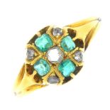 A mid Victorian gold emerald and diamond ring. The rose-cut diamond, within a cushion-shape