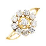 A diamond cluster ring. The brilliant-cut diamond, within a similarly-cut diamond halo, to the