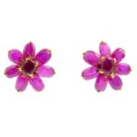 A pair of synthetic ruby floral cluster earrings. Each designed as an oval-shape synthetic ruby,
