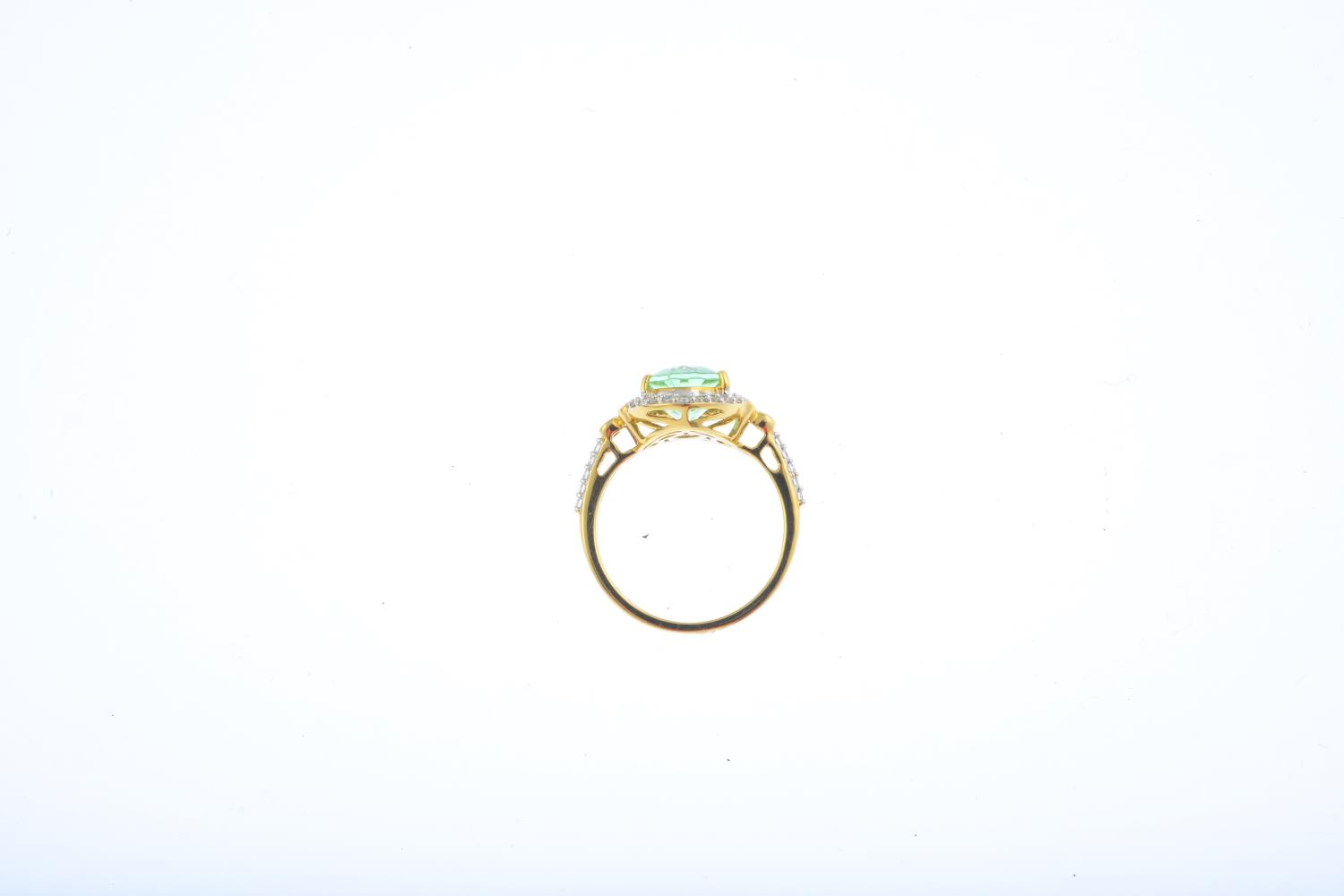 An 18ct gold tourmaline and diamond cluster ring. The oval-shape tourmaline, with brilliant-cut - Image 2 of 3