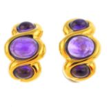 A pair of amethyst earrings. Each designed as a graduated oval amethyst cabochon line, with curved