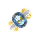 An 18ct gold sapphire and diamond ring. Of bi-colour design, the oval-shape sapphire, with