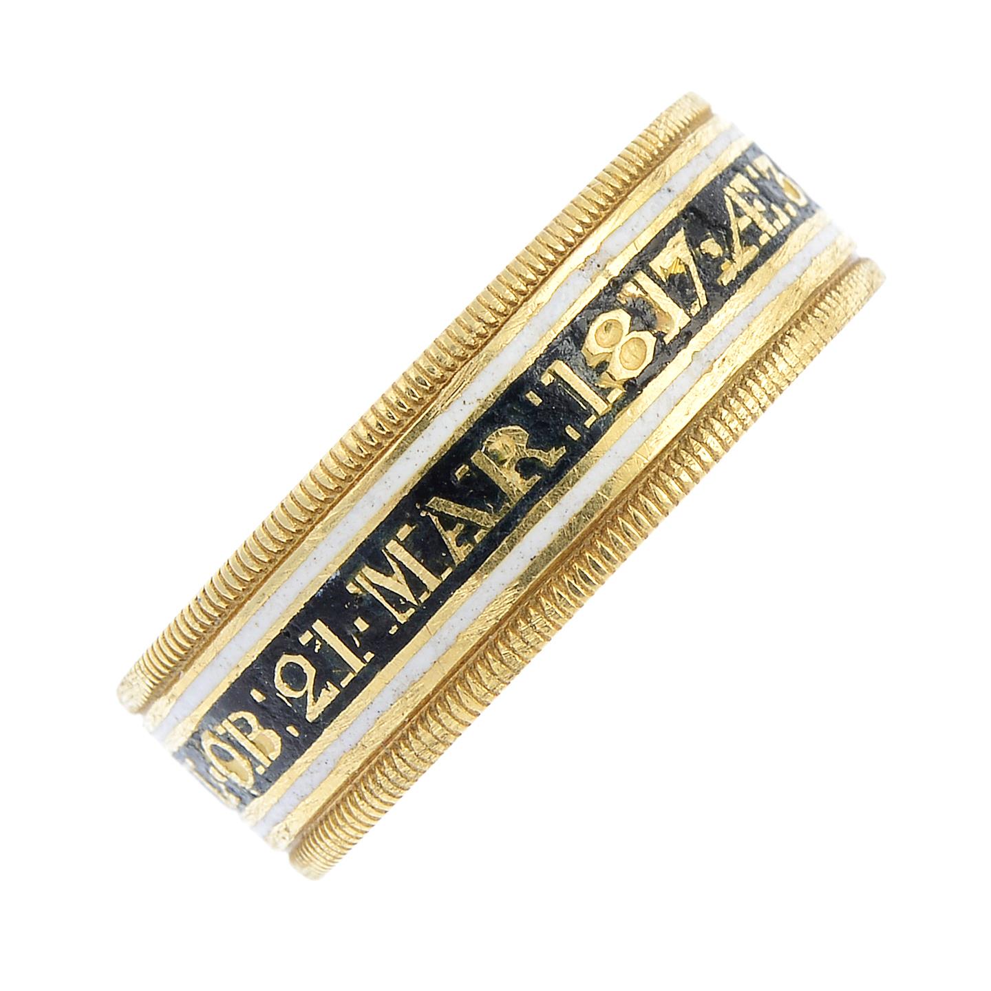 A late Georgian 18ct gold enamel memorial band ring. The black and white enamel band, reading '