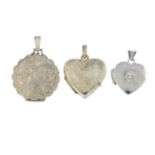 Twenty-four lockets. To include a silver oval locket, a silver foliate and scrolling motif