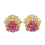 (206711) A pair of ruby and diamond earrings. Each of geometric design, the oval ruby cabochon