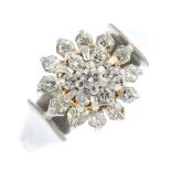 A 1970s platinum diamond cluster ring. The brilliant-cut diamond, within a similarly-cut diamond