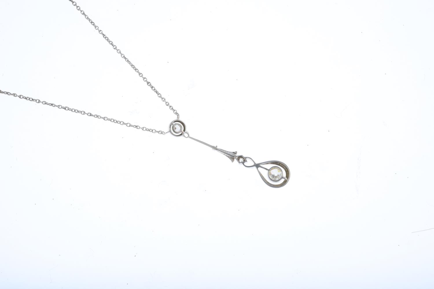 A diamond necklace. The old-cut diamond collet within in a pear-shape halo, suspended from a - Image 2 of 3