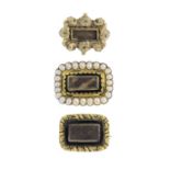 Three late Georgian gold mourning brooches. To include a woven hair black enamel and split pearl