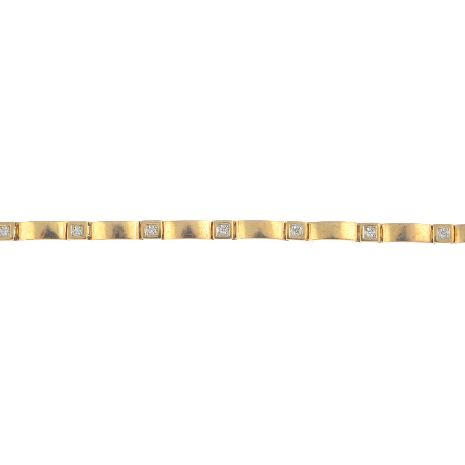 A 9ct gold diamond bracelet. The brilliant-cut diamond collet line, with polished rectangular-link