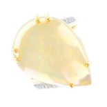 An 18ct gold opal and diamond ring. The pear opal cabochon, with brilliant-cut diamond line