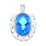 A topaz pendant. The oval-shape blue topaz, with openwork scrolling surround, suspended from a