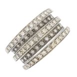 A 9ct gold diamond dress ring. Designed as a series of multi-row brilliant-cut diamond stepped