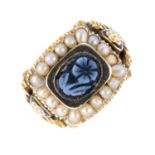 A Georgian gold onyx cameo, split pearl and enamel mourning ring. The oval onyx depicting a forget-