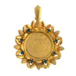 A pendant. The coin, within a green paste accent foliate mount. Length 5.3cms. Weight 18.1gms.