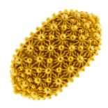 An 18ct gold dress ring. Designed as a beaded panel, with rope-twist accent band. Italian marks.